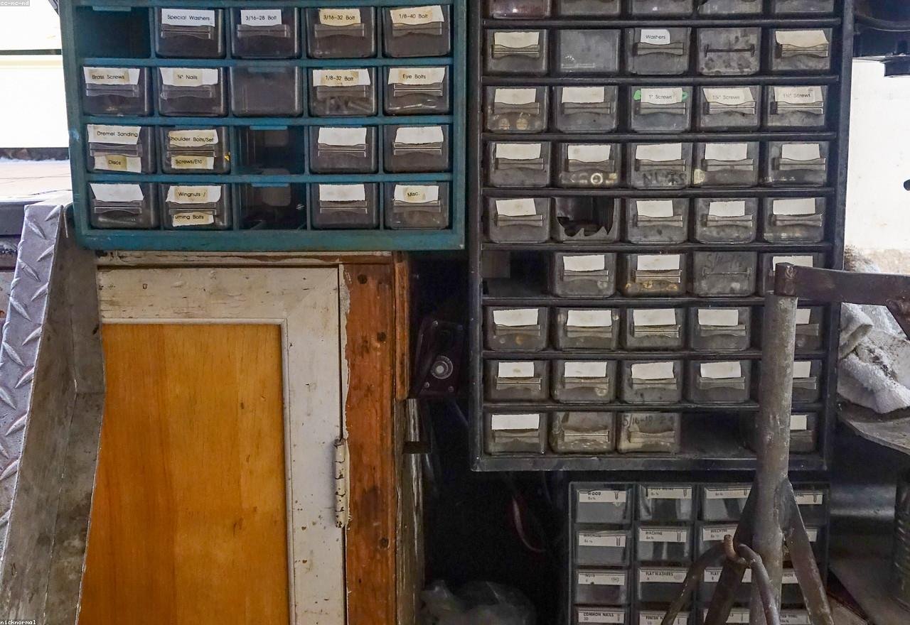 Neatly organised drawers of hardware and fasteners in a trade supply store